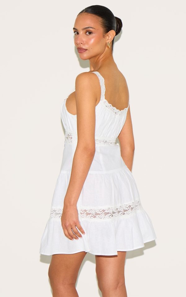 4162455355d6597504d9b350f52a3e30e6f513f8_CNM4417_2_petite_white_tiered_mini_dress_with_lace_details